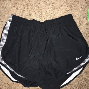 Black and grey women’s Nike running shorts